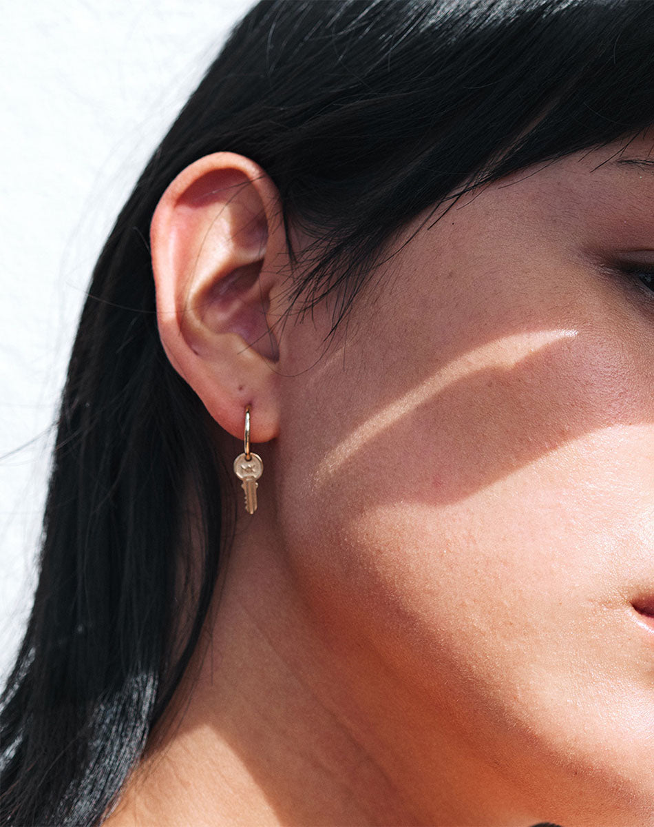 Hoop earring with key hot sale