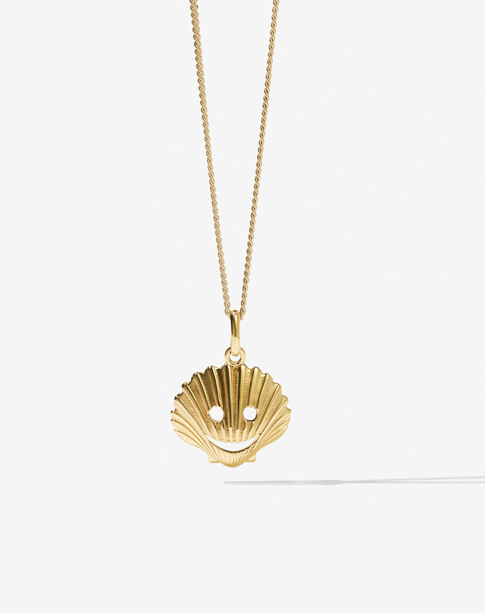 Gold shell new arrivals locket