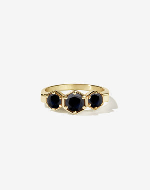 Meadowlark Jewellery’s classic 3 Hexagon Stone Engagement Ring in 18ct Yellow Gold, claw set with round brilliant cut midnight sapphire. A bold and beloved 3 stone ring, this Ceremonial design is made to order in New Zealand.