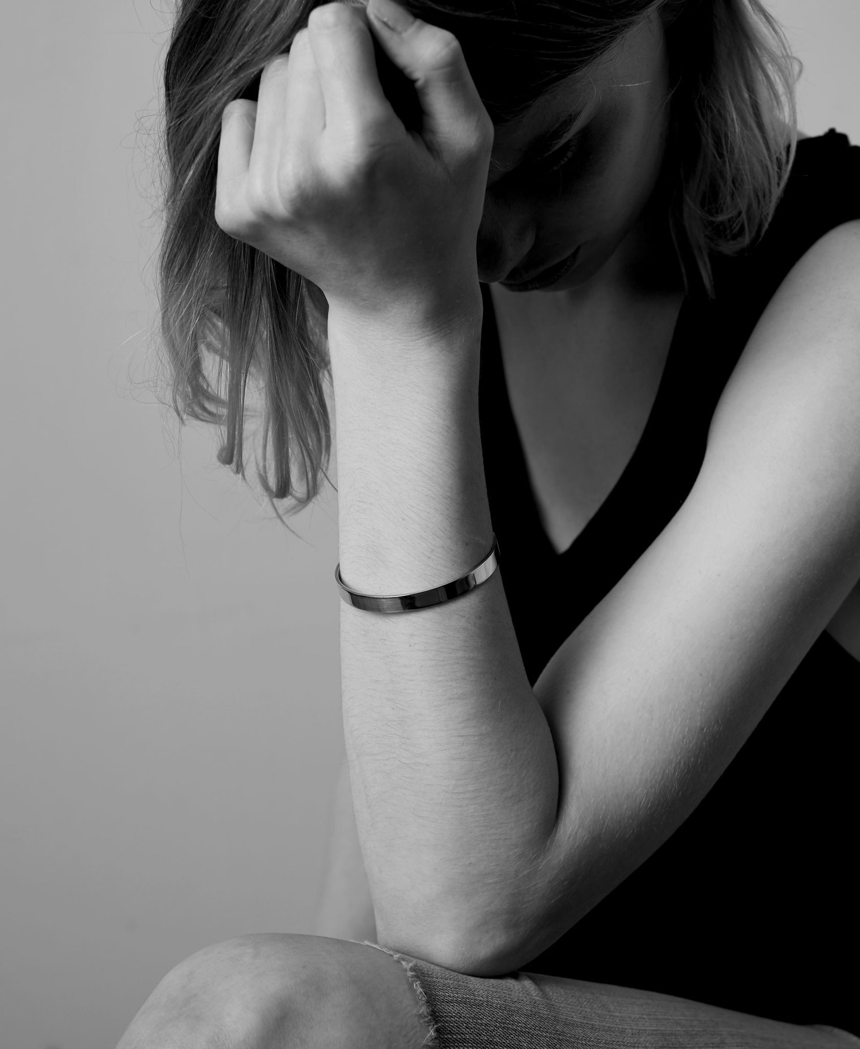 wide and flat bangle worn on a model