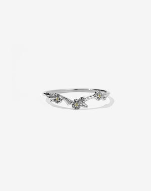 A sterling silver band ring with three flower motifs, each set with a round brilliant stone.