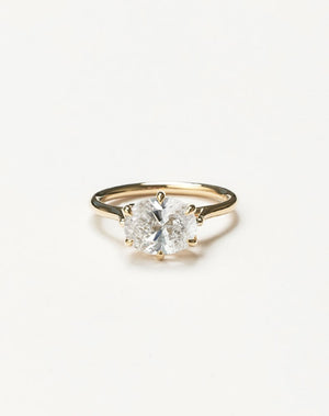 Yellow gold oval east west diamond engagement ring 