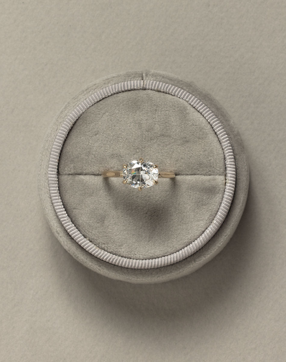 Yellow gold oval east west diamond solitaire engagement ring in grey ring box