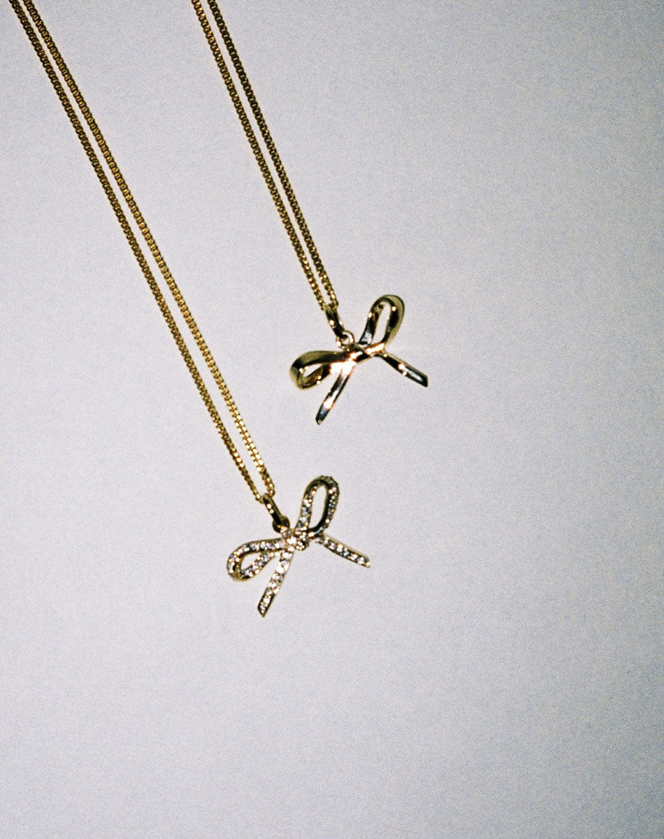 Gold bow necklaces with diamonds