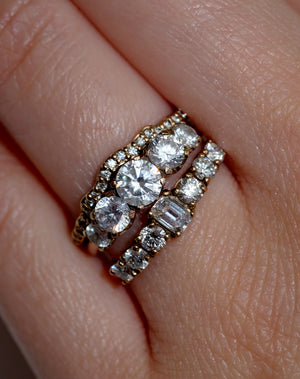 Meadowlark Jewellery’s classic Signature 5 Stone Engagement Ring in 9ct Yellow Gold, with 1.09ct round brilliant cut white diamonds. Set into our signature Meadowlark claw setting, featuring graphic lines inspired by our insignia. Pair with our bestseller, the Amelie Band Pave or Plain. One of our most timeless and beloved Ceremonial designs, made in New Zealand. Worn on model with the Eternal Wedding Band Pave and Amelia Engagement Ring.