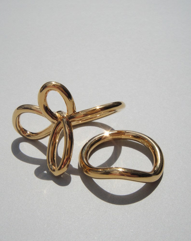 Gold flower ring and curved band