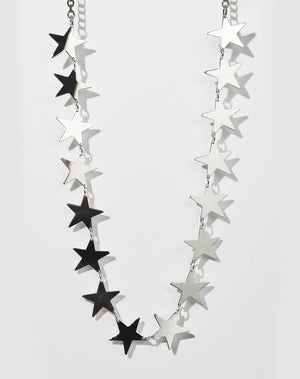 A sterling silver necklace with a series of star-shaped charms linked together.