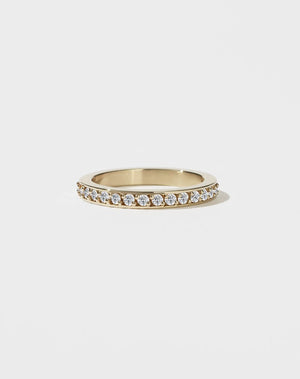 A square-shaped, chunky wedding band in 9ct yellow gold, set with small round brilliant diamonds.