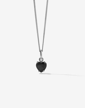 Necklace with a black onyx heart-shaped pendant on a white background