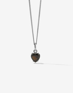Necklace with a heart-shaped smoky quartz pendant on a white background