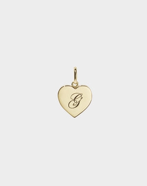 A 9ct solid gold heart-shaped charm with an engraved letter 'G' on it.