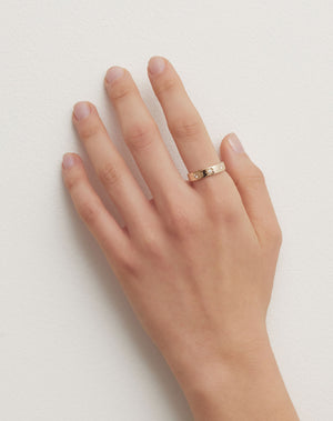 Lulu 3 Star Band in 9ct Yellow Gold with star set round brilliant cut White Diamond. 4.5mm width wedding band. Worn on model hand.