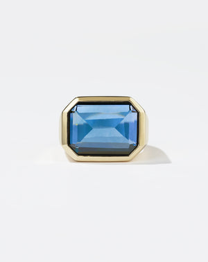 Meadowlark Jewellery's bold Limited Edition Milan Cocktail Ring in 9ct Yellow Gold, bezel set with an emerald-cut blue topaz stone. A classic and timeless design, to celebrate milestones or bring decadence to everyday. Made to order in New Zealand, at the Meadowlark workshop. A bolder version of our Milan Ring.