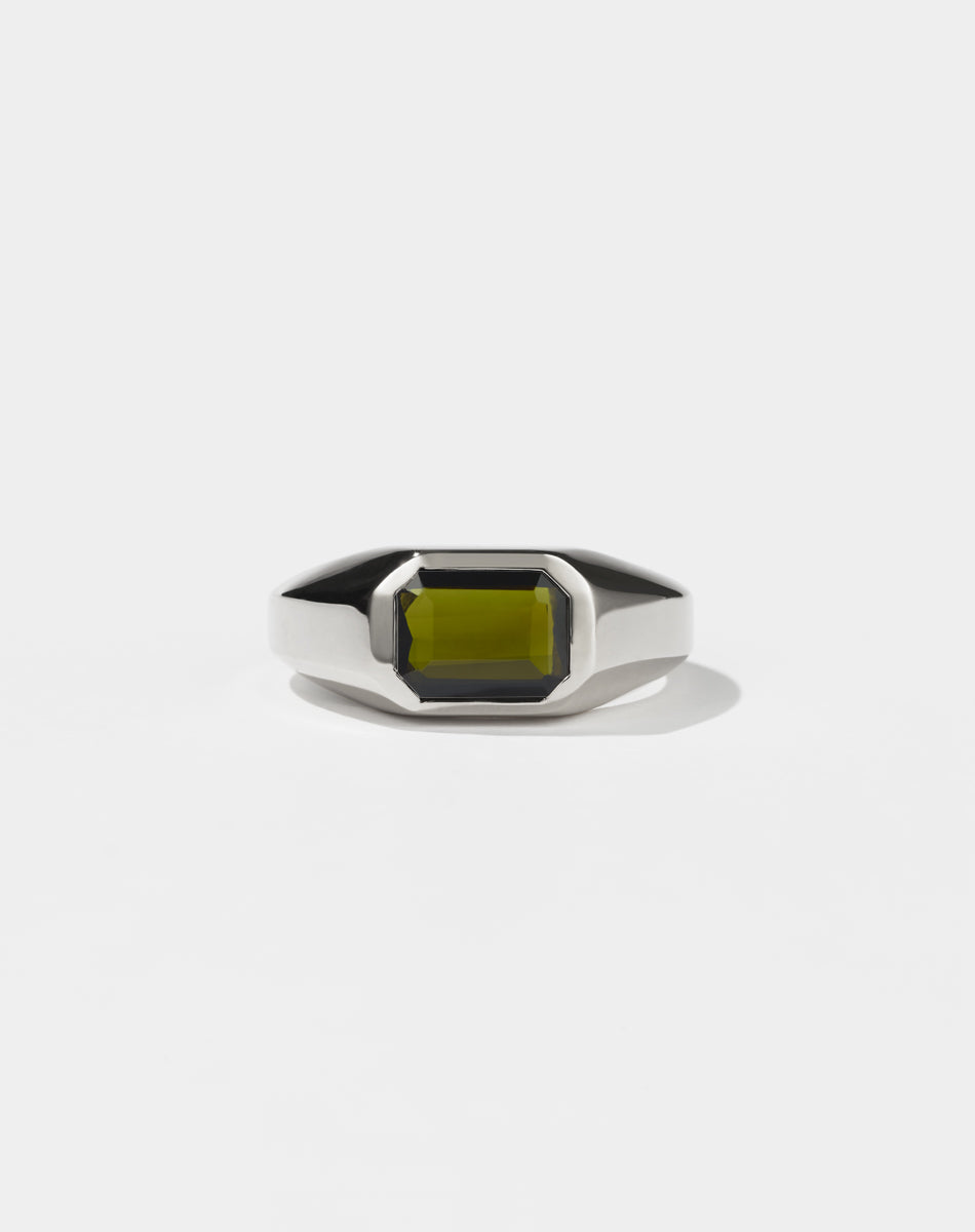 A sterling silver ring with a Green Tourmaline gemstone on a white background. Made by Meadowlark Jewellery in New Zealand.