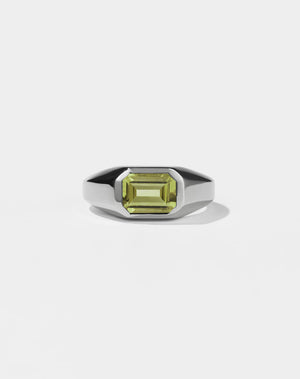 A sterling silver ring with a Peridot gemstone on a white background. Made by Meadowlark Jewellery in New Zealand.