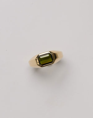Meadowlark Jewellery's bold Limited Edition Milan Ring in 9ct Yellow Gold, bezel set with an emerald-cut green tourmaline stone. A classic and timeless design, perfect as a wedding band or a minimalist piece for everyday. Made to order in New Zealand, at the Meadowlark workshop.