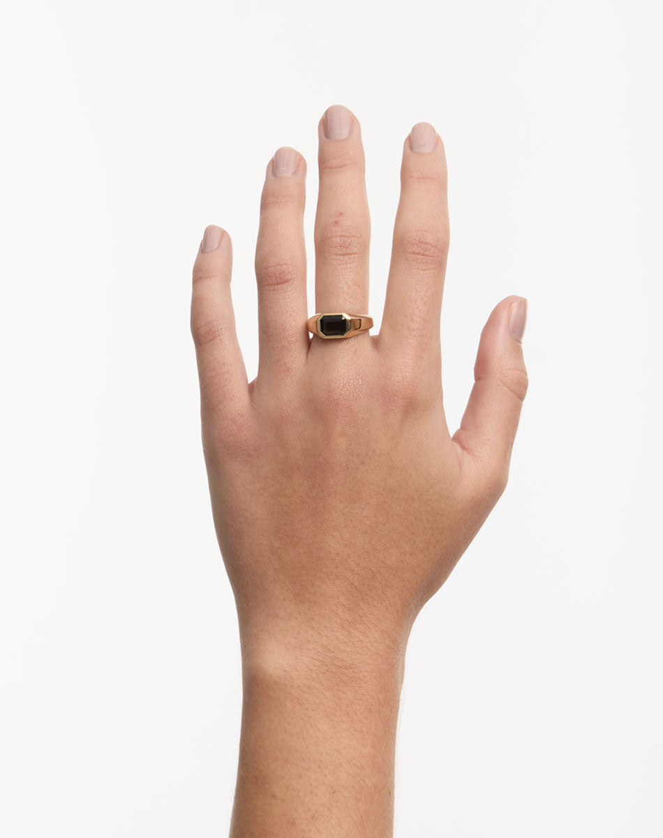 Meadowlark Jewellery's bold Limited Edition Milan Ring in 9ct Yellow Gold, bezel set with an emerald-cut green tourmaline stone. A classic and timeless design, perfect as a wedding band or a minimalist piece for everyday. Made to order in New Zealand, at the Meadowlark workshop.