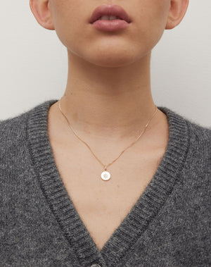 Violet Necklace with floral engraving in 9ct Yellow Gold. Set with White Diamond. 11m diameter pendant. 40cm or 45cm diamond curb chain. Worn on model.