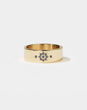 Violet Ring with floral engraving in 9ct Yellow Gold. Set with round brilliant cut Blue Sapphire. 6.4mm width wedding band.