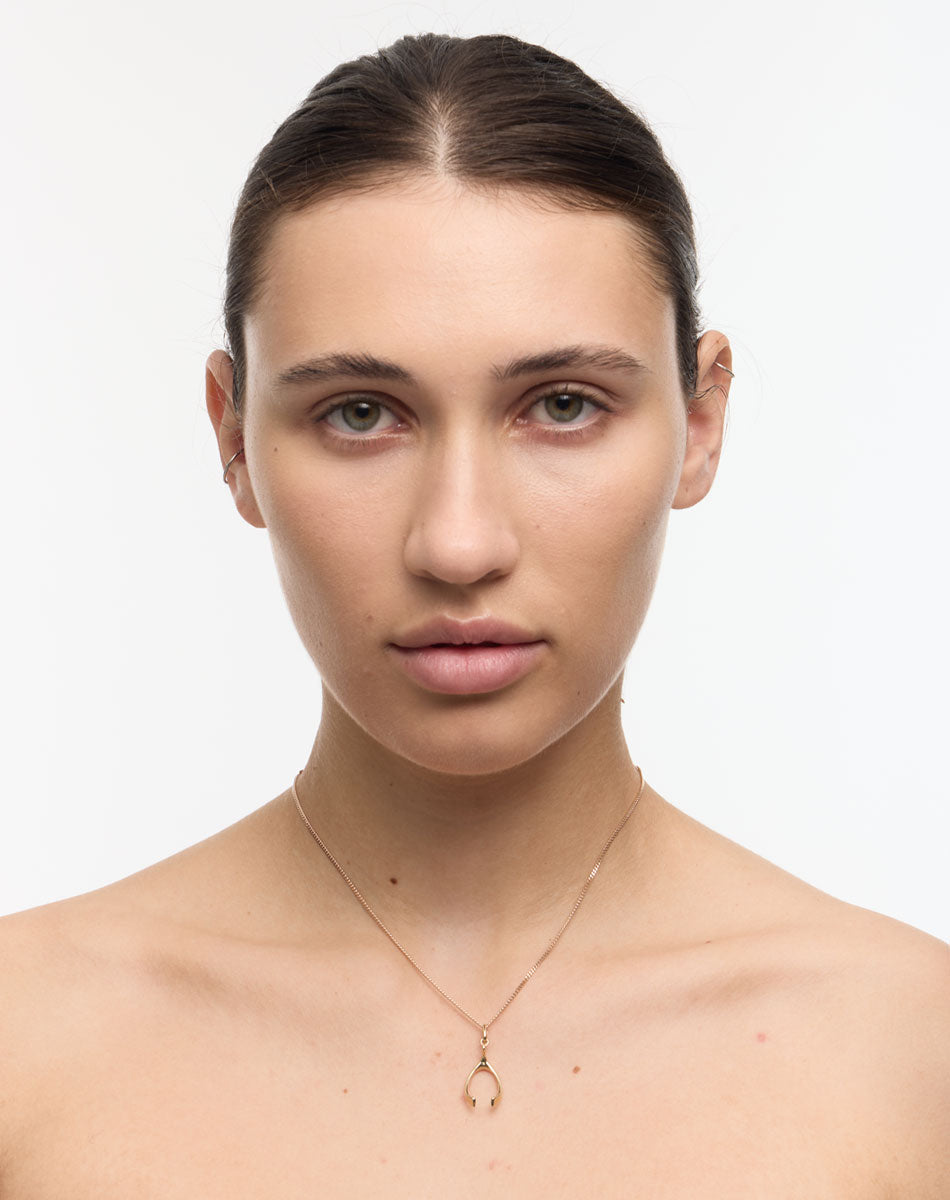 Gold Wishbone Charm Necklace on Model