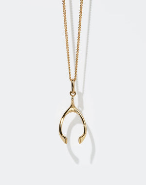 Gold wishbone charm necklace