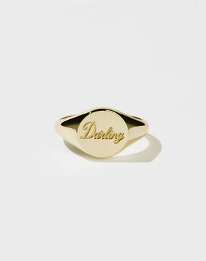 A 9ct solid gold signet ring with the word Darling engraved on the top surface