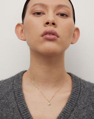 Lulu Necklace in 23k Gold Plated or 9ct Yellow with star set White Diamond. 6mm diameter pendant on 40cm or 45cm diamond curb chain. Worn on model.