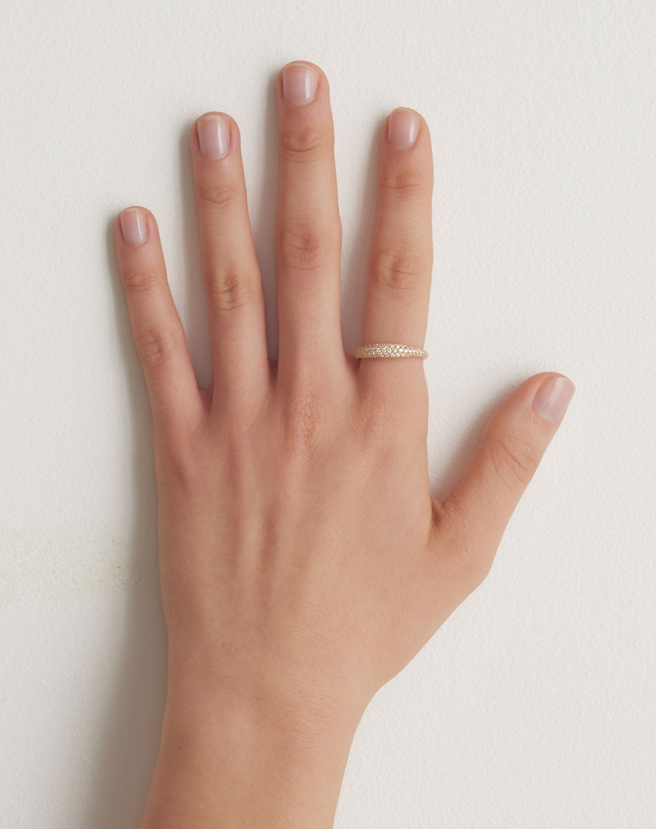 Mini Claude Ring Pave in 9ct Yellow Gold with round brilliant cut, pave set white diamonds. 0.40 carats. 2mm to 4.5mm width wedding band. Worn on model hand.