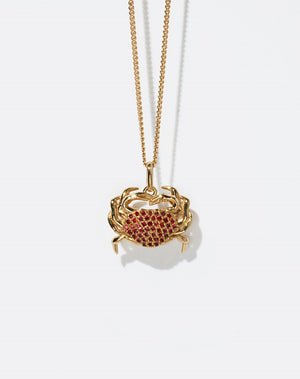 Gold crab-shaped pendant necklace with red stones 
