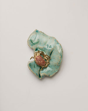 Gold crab charm pendant set with red sapphires 