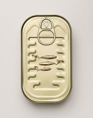 Gold-colored can with sardine charms  