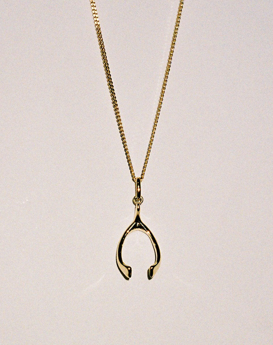 Gold wishbone pendant necklace 