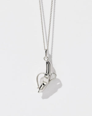 A sterling silver necklace featuring a charm in the shape of a banana