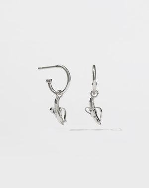 A pair of sterling silver hoop earrings with small banana charms