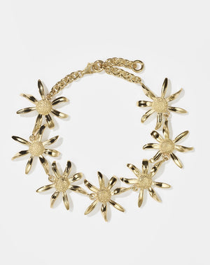 A gold-plated bracelet featuring a chain link with seven daisy flower designs