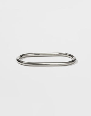 A sterling silver double ring with a minimalist round band that fits across two fingers.