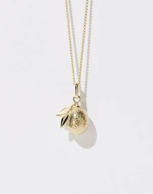 A 23k gold plated lemon-shaped charm necklace on a fine chain.