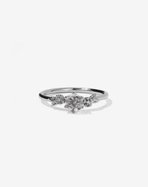 Meadowlark Jewellery’s iconic Alba Engagement Ring in Platinum, claw set with a round brilliant cut grey diamond. Round band adorned with flowers, set with round brilliant cut grey diamonds. Pair with our bestseller, the Alba Band Stone Set or Plain. Made in New Zealand.