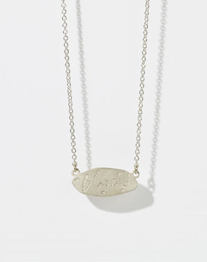 Meadowlark Jewellery’s Blessed Necklace in Sterling Silver. A meaningful talisman for life’s journey, to serve as a daily reminder to honour the present and embrace gratitude for the quiet abundance all around us. A classic name tag in a matte, brushed texture inspired by ancient heirlooms hung from a fine diamond curb chain. From the Dreams collection.
