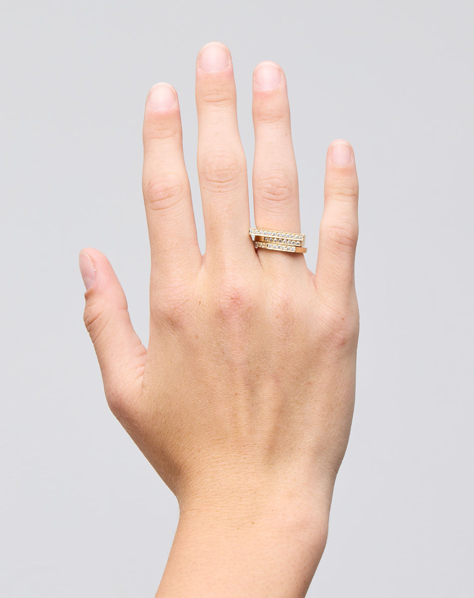 Meadowlark Jewellery’s architectural Geo Ring Arc in 9ct Yellow Gold, pave set with twelve round brilliant cut white diamonds atop a 1.5mm. A striking piece designed to be worn with the Geo Flat & Geo Point rings, or alone for a refined and minimal look. From the Dreams collection.