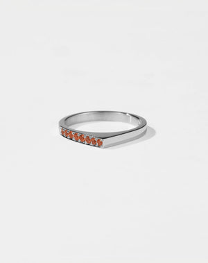 Meadowlark Jewellery’s architectural Geo Ring Point in Sterling Silver, pave set with twelve round brilliant cut orange sapphires atop a 1.5mm. A striking piece designed to be worn with the Geo Flat & Geo Arc rings, or alone for a refined and minimal look. From the Dreams collection.