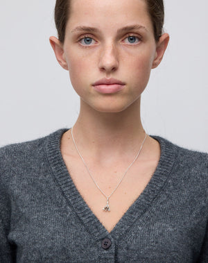 Meadowlark Jewellery’s Magda Charm Necklace in Sterling Silver. A single bell-shaped flower charm suspended from a fine diamond curb chain. A symbol of quiet transformation and the tender strength of nature. From the Dreams collection.