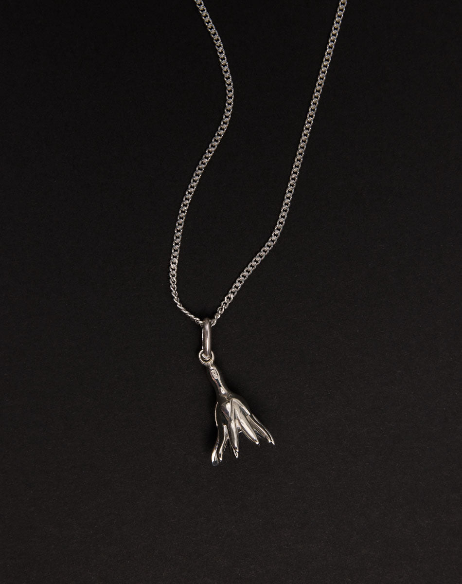 Meadowlark Jewellery’s Magda Charm Necklace in Sterling Silver. A single bell-shaped flower charm suspended from a fine diamond curb chain. A symbol of quiet transformation and the tender strength of nature. From the Dreams collection.