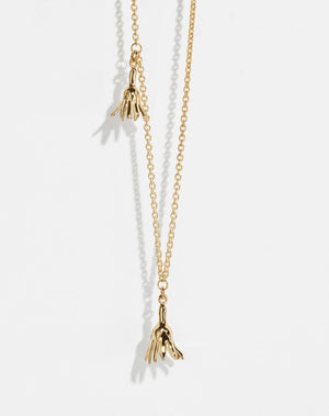 Meadowlark Jewellery’s Magda Two Charm Necklace in 23k Gold Plated Sterling Silver or 9ct Yellow Gold. Two delicate, bell-shaped flower charms suspended from a fine diamond curb chain. A minimalist ode to blooming and the enduring cycles of life. From the Dreams collection.