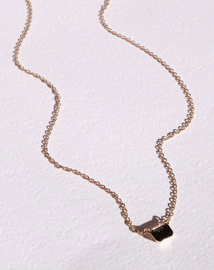 Meadowlark Jewellery's Limited Edition Milan Necklace in 9ct Yellow Gold with an emerald-cut green tourmaline stone held boldly in a distinctive bezel setting. Hung from an adjustable 40cm-45cm fine chain necklace. A classic and timeless design, perfect to stack with your favourite chains or a minimalist piece for everyday. Made to order in New Zealand, at the Meadowlark workshop.