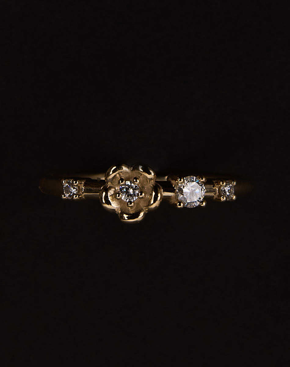 Meadowlark Jewellery’s floral Posie Band in 9ct Yellow Gold, set with round brilliant cut white diamonds. Inspired by classic floral motifs and our beloved Alba designs, a timeless symbol of grace, growth and renewal. Celebrating life’s continual renewal. From the Dreams collection.