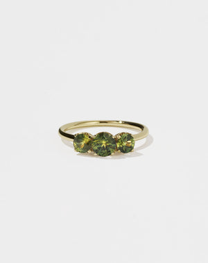Meadowlark Jewellery’s classic Signature 3 Stone Engagement Ring in 14ct Yellow Gold, with round brilliant cut green sapphires. Fully traceable and ethically sourced blue and green sapphires from Queensland, Australia. Set into our signature Meadowlark claw setting, featuring graphic lines inspired by our insignia. Pair with our bestseller, the Amelie Band Pave or Plain. One of our most timeless and beloved Ceremonial designs, made to order in New Zealand.