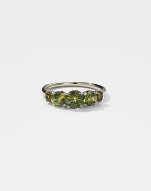 Meadowlark Jewellery’s classic Signature 5 Stone Engagement Ring in 14ct White Gold, with round brilliant cut green sapphires. Fully traceable and ethically sourced blue and green sapphires from Queensland, Australia. Set into our signature Meadowlark claw setting, featuring graphic lines inspired by our insignia. Pair with our bestseller, the Amelie Band Pave or Plain. One of our most timeless and beloved Ceremonial designs, made in New Zealand.