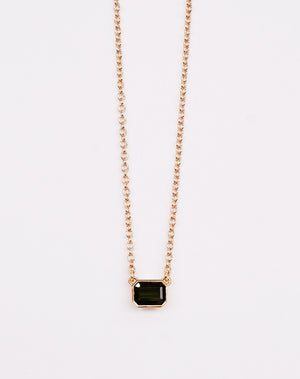 Meadowlark Jewellery's Limited Edition Milan Necklace in 9ct Yellow Gold with an emerald-cut green tourmaline and Thai Garnet stone held boldly in a distinctive bezel setting. Hung from an adjustable 40cm-45cm fine chain necklace. A classic and timeless design, perfect to stack with your favourite chains or a minimalist piece for everyday. Made to order in New Zealand, at the Meadowlark workshop.