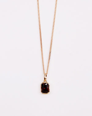 Meadowlark Jewellery's Limited Edition Milan Necklace in 9ct Yellow Gold with an emerald-cut Thai garnet stone held boldly in a distinctive bezel setting. Hung from a 40cm fine chain necklace. A classic and timeless design, perfect to stack with your favourite chains or a minimalist piece for everyday. Made to order in New Zealand, at the Meadowlark workshop.